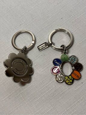 Coach Silver Flower Keychains silver. 1 w Multicolored Petals. Stamped. Set of 2